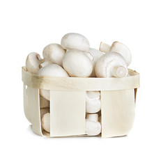 Champignon mushrooms in a wooden container