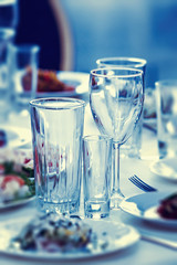 Glasses for drinks and cocktails at the festive table