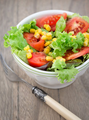 Fresh mixed salad with tomatoes, corn