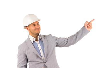 Smiling Engineer on White Helmet Pointing Side