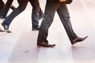 Suits crossing street