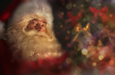 Santa Claus near Christmas tree