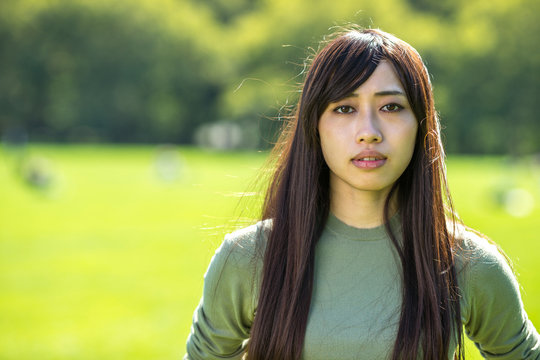 Young Asian Woman sad concerned serious sad face prtraif