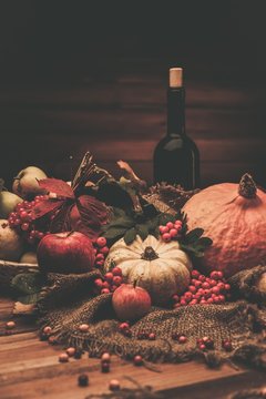 Thanksgiving day autumnal still life with bottle of wine