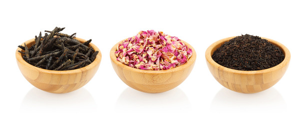 Assortment of tea in a wooden bowl. Kuding, rose, black tea