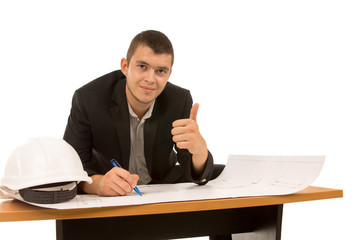 Smiling architect giving a thumbs up gesture