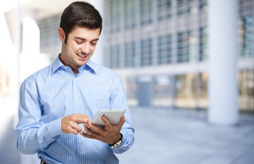 Young man using his tablet