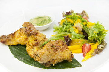 chicken in curry with salad and sauce