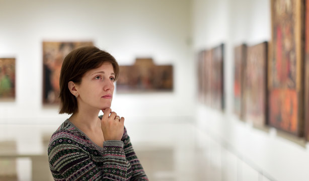 visitor looking pictures in  gallery