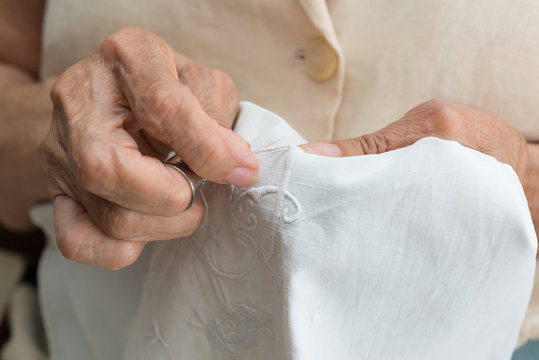 Senior woman sewing