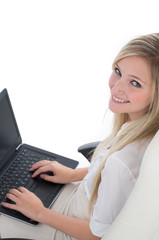 Naklejka premium Blond Woman with Laptop Smiling Up at Camera
