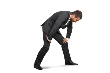 tired businessman doubled over