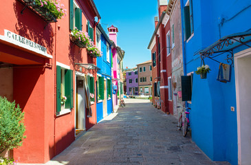 Fototapeta na wymiar Street with colorful buildings in Burano island, Venice, Italy