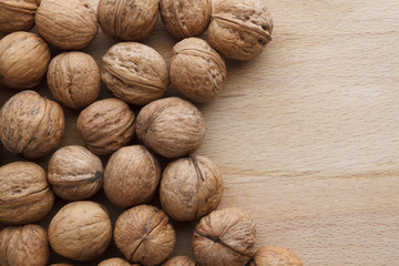 Walnut on wooden background