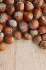 Hazelnut on wooden background