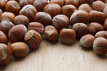 Hazelnut on wooden background
