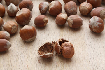 Hazelnut on wooden background