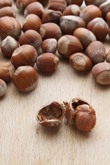 Hazelnut on wooden background