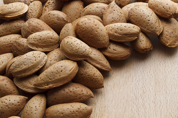 Fototapeta premium Almond on wooden background