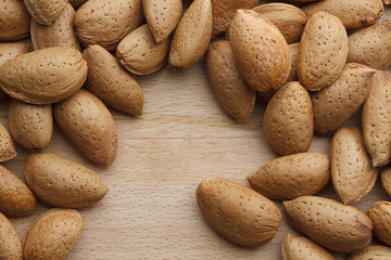 Almond on wooden background