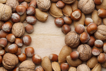 Nuts on wooden background