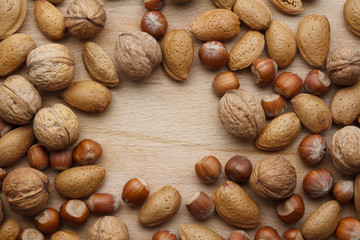 Nuts on wooden background