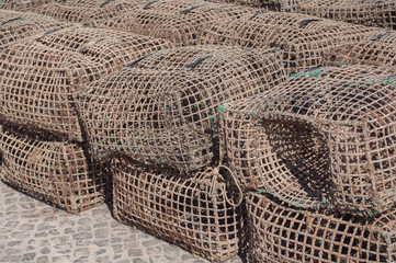 Some fishing cages stacked on the ground
