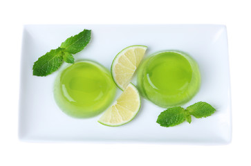 Green jelly with mint leaves isolated on white