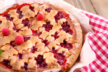 Tasty cake with berries on table close-up