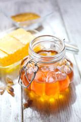 Fresh honey on wooden table