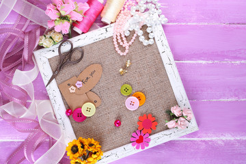Scrapbooking craft materials and wooden frame with sackcloth