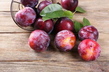 Sweet plums on wooden background