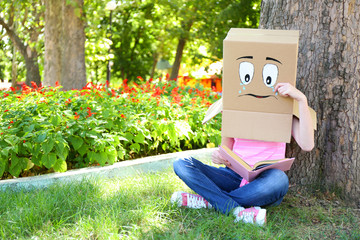 Woman with cardboard box