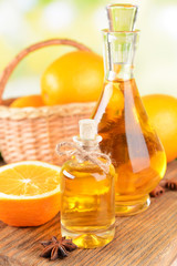 Orange oil on table on light background