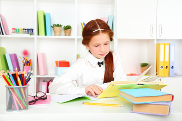 Cute girl at workplace in classroom