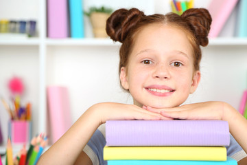 Cute girl at workplace in classroom