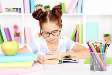 Cute girl at workplace in classroom