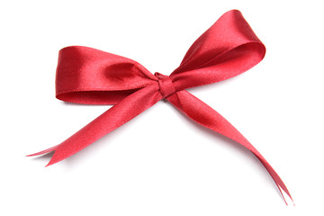 Shiny red ribbon with bow isolated on white