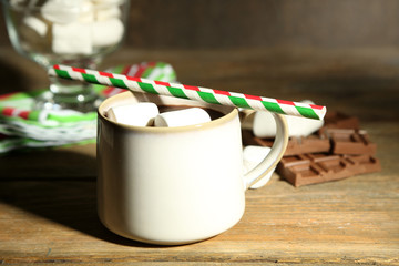 Hot chocolate with marshmallows, on wooden background