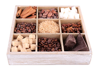 Wooden box with set of coffee and cocoa beans, sugar cubes,