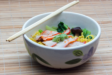 Chinese egg noodles with red pork in hot soup