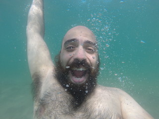underwater man in summer happy