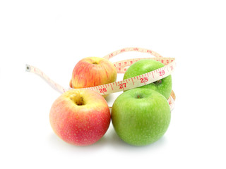 measuring tape wrapped around a green apple for diet