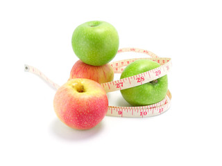 measuring tape wrapped around a green apple for diet