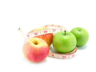 measuring tape wrapped around a green apple for diet
