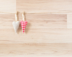 Fototapeta na wymiar Hearts on wooden background.