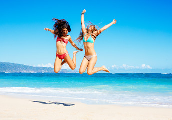 Beautiful Girls Jumping on the Beach