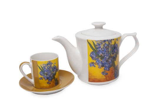 White ceramic kettel and mug over white background