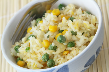 Fried rice with egg, green peas and sweetcorn