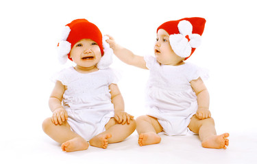 Two twins baby in hats